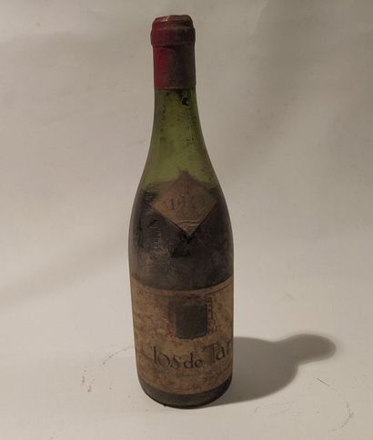 A bottle of Clos de Tart Momessin. Burgundy...