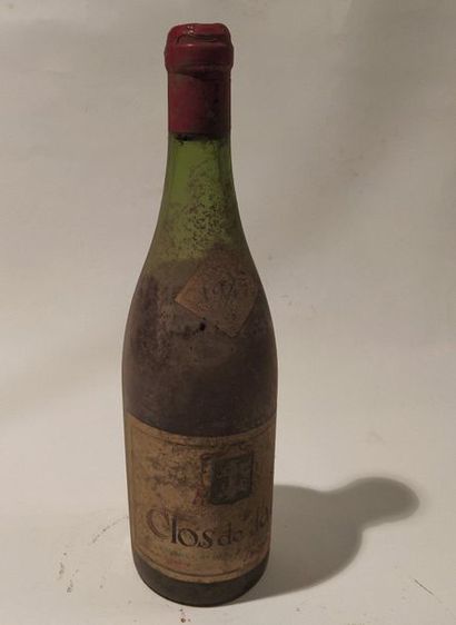 null A bottle of Clos de Tart Momessin. Burgundy appellation contrôlée
- 1945. Level...