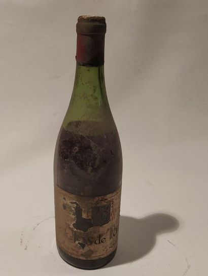 A bottle of Clos de Tart Momessin. Burgundy...