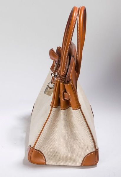HERMES Birkin. 30 cm
Handbag in natural "Barenia" calfskin, beige "H" canvas.
Palladium...