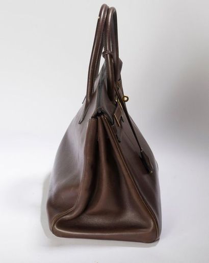 HERMES Birkin. Thirty-five inches.
Brown "Barenia" calfskin handbag. Gold-plated
metal...