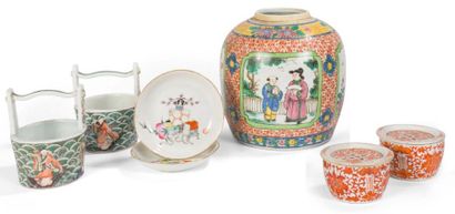 null A set comprising a ginger pot in porcelain and rose family enamels decorated...