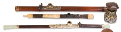 null Three opium pipes, of bamboo, paktong and ivory; of wood and serpentine; of...
