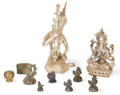 null Set of bronze subjects and opium weights.
Various Asia, 20th century
Three red...