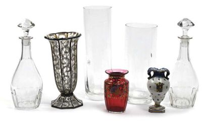 null Set including a glass vase on a pedestal with a stylized painted floral decoration....