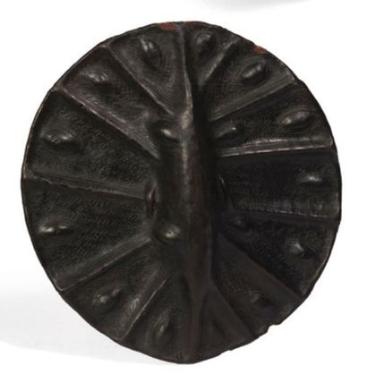 null Rare leather shield decorated with embossed patterns. Deep shiny black patina...