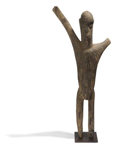 null Bateba statue with raised arms made of wood with a sacrificial patina.
Lobi...