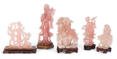 null Suite of five rose quartz statuettes decorated with Guanines, plants and flowers
China;...