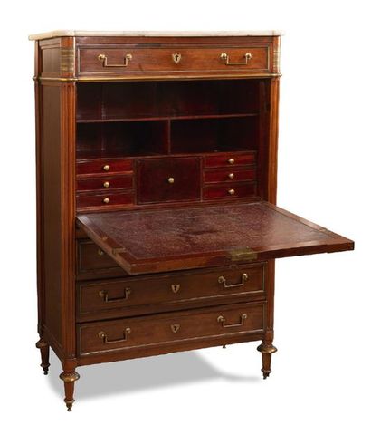 null Mahogany and mahogany veneer secretary opening by four drawers and a leaf revealing...