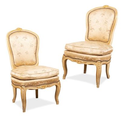 null Pair of carved, moulded, lacquered and gilded wood fire corner chairs decorated...