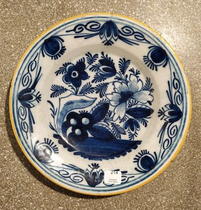 null DELFT. Plate with plain rim decorated in blue monochrome with a pierced rock...