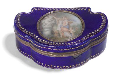 null - Three-lobed blue enamelled metal box decorated with a frieze of flowers.
The...