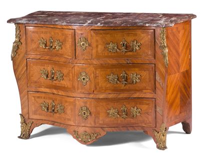 null Veneer chest of drawers with geometrical decoration, the front and sides curved....