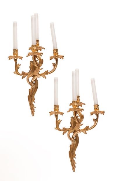 Pair of four-light sconces in chased and...