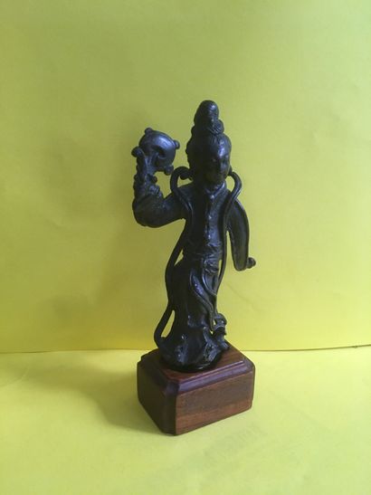 null Small bronze subject with a brown patina depicting a dancer surrounded by her...