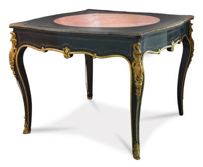  Living room table in ebony and brass veneer and marquetry with decorations of fillets,...