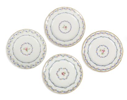 Suite of four soft paste plates with polychrome...
