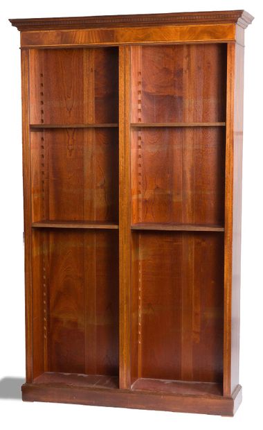 null Bookcase in mahogany, mahogany veneer and net marquetry. Topped by a cornice....
