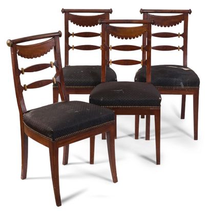  Suite of four chairs in mahogany and mahogany veneer. The openwork backrest is decorated...