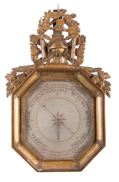 null Barometer in carved wood and formerly gilded with world map, flowers and foliage...