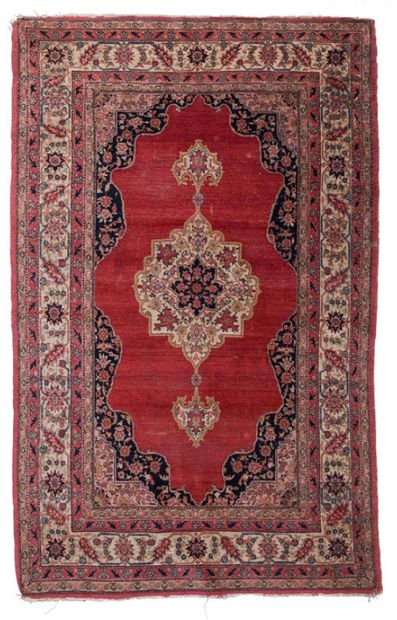 null Polychrome wool carpet with flowers and palmettes on a red background.
Iran....