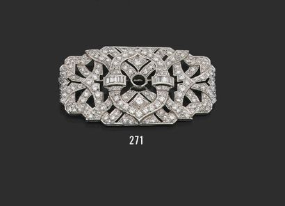 null A platinum plate brooch with a finely openwork geometrical design, set with...