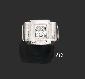 null Open book" platinum signet ring, set with a cushion-cut diamond.
Diamond weight:...