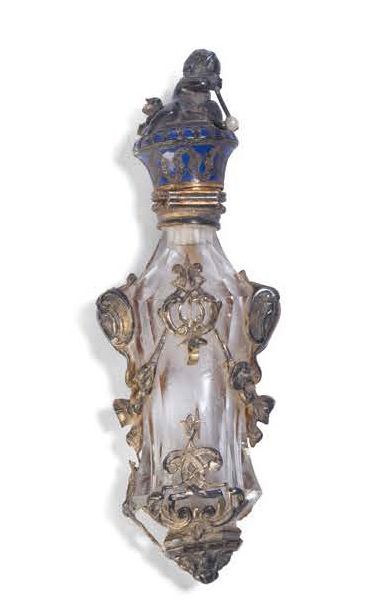 null A silver bronze and enamel baluster-shaped salt bottle, the frame decorated...