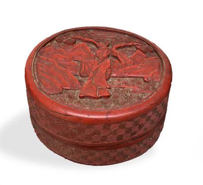 null A cinnabar lacquer covered box, decorated with a sage under a longevity pine,...