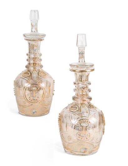 null A pair of French crystal bottles for the Orient, gilt vermiculated and polychrome...
