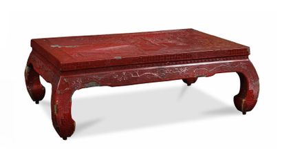 null 
A kan scholar's table in cinnabar lacquer, with carved decoration representing...