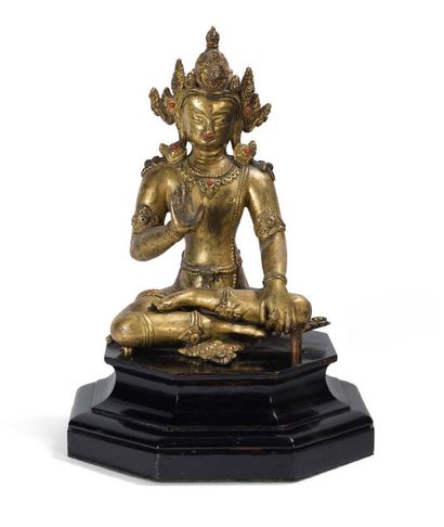 null Gilt bronze statue of a seated boddhisattva in meditation, right hand in abhaya...