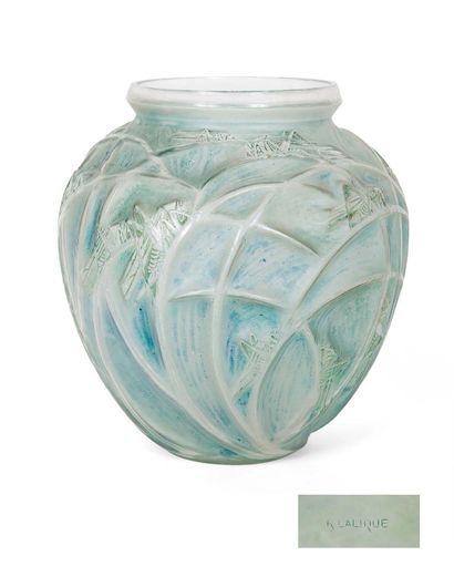 RENE LALIQUE (1860-1945) Sauterelles
Blown-moulded and patinated glass vase.
Signed...