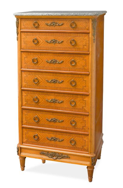 null Wooden veneer cabinet opening to seven drawers with frieze decoration.
Straight...