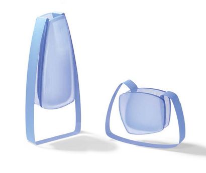 null Pair of blue-tinted plexiglass vases
Unreadable signature