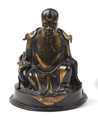 null Bouddha en bronze ciselé patiné et doré.
Chine, XIXème siècle
H.13 cm