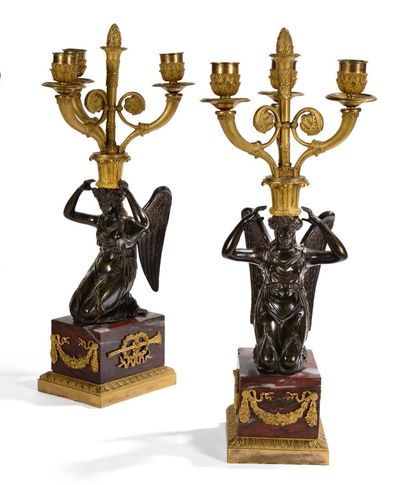  Pair of three-light torches in chased, patinated and gilded bronze, decorated with...