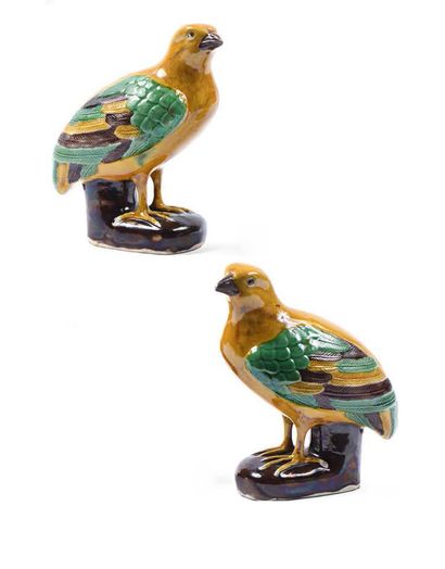 A pair of sancai glazed ceramic quails, perched...