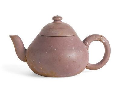 Small yixing stoneware teapot, brown in colour....