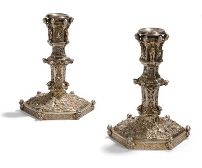 Pair of silver and vermeil torches, the central...