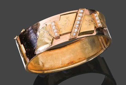 null Bracelet ruban en or jaune (750), serti de petites perles
Pb: 22,48 gr