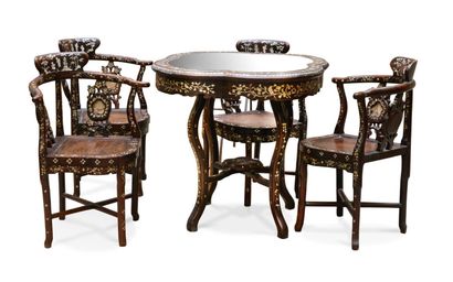 Table and four armchairs of the Chinese restaurant...