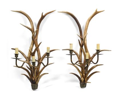 null Pair of three-light sconces with deer antler decoration joined by a turned brass...