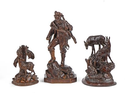 null Set including a returning hunter with a chamois, and two groups in carved and...