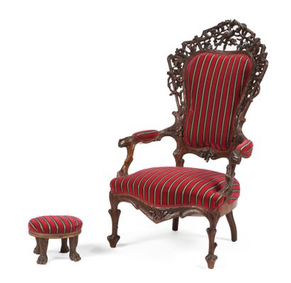null Armchair with a large back in molded wood and carved with oak leaves and birds....