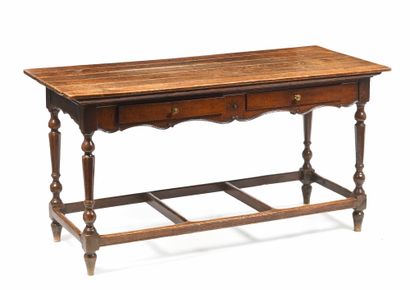 null Table in molded wood and patina opening by two drawers in belt. It rests on...