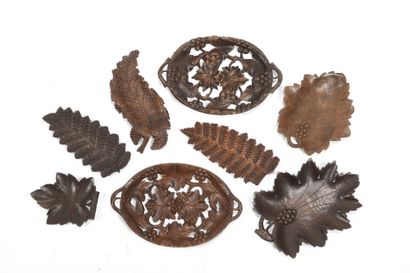 null Set of eight trays in carved wood, patinated, and openwork for some, with decorations...