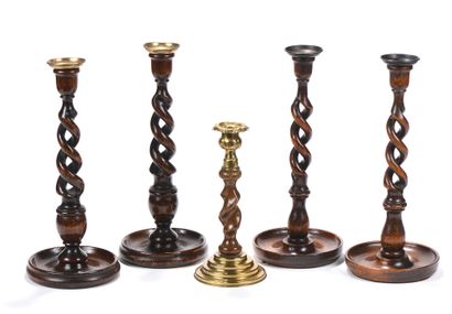 Two pairs of wooden candlesticks with twisted...