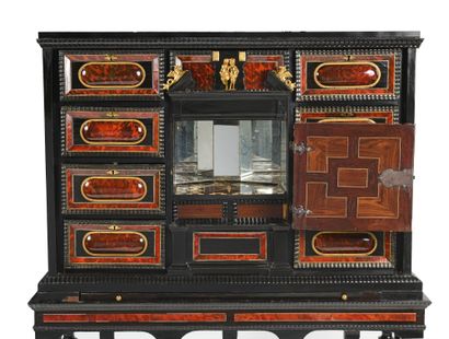 null Cabinet in ebony and tortoiseshell marquetry. It opens with nine drawers and...