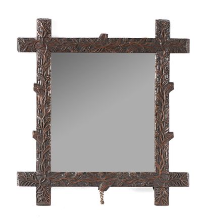null Mirror, carved and patinated wood frame with vegetal decoration Late 19th century

H....